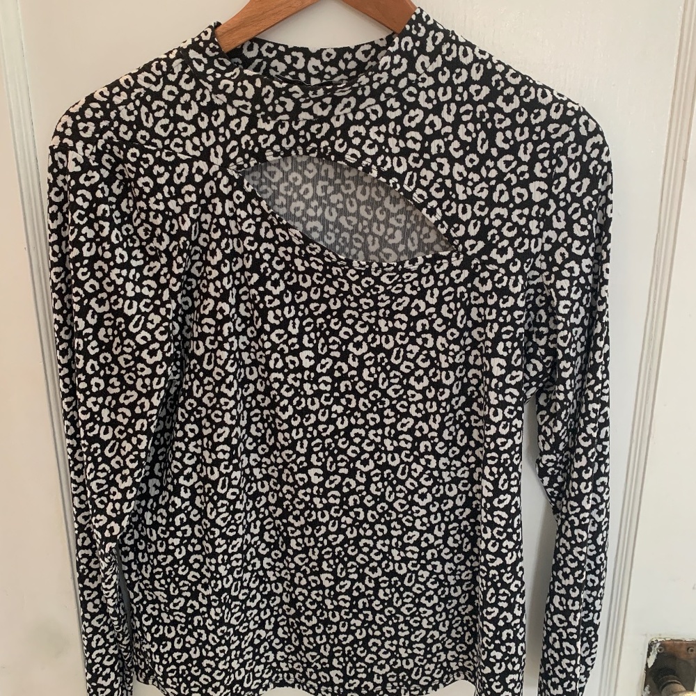 Suzy Shier mock neck top w/ asymmetrical cut out at neckline black & white print